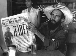 Camilo Cienfuegos with newspaper